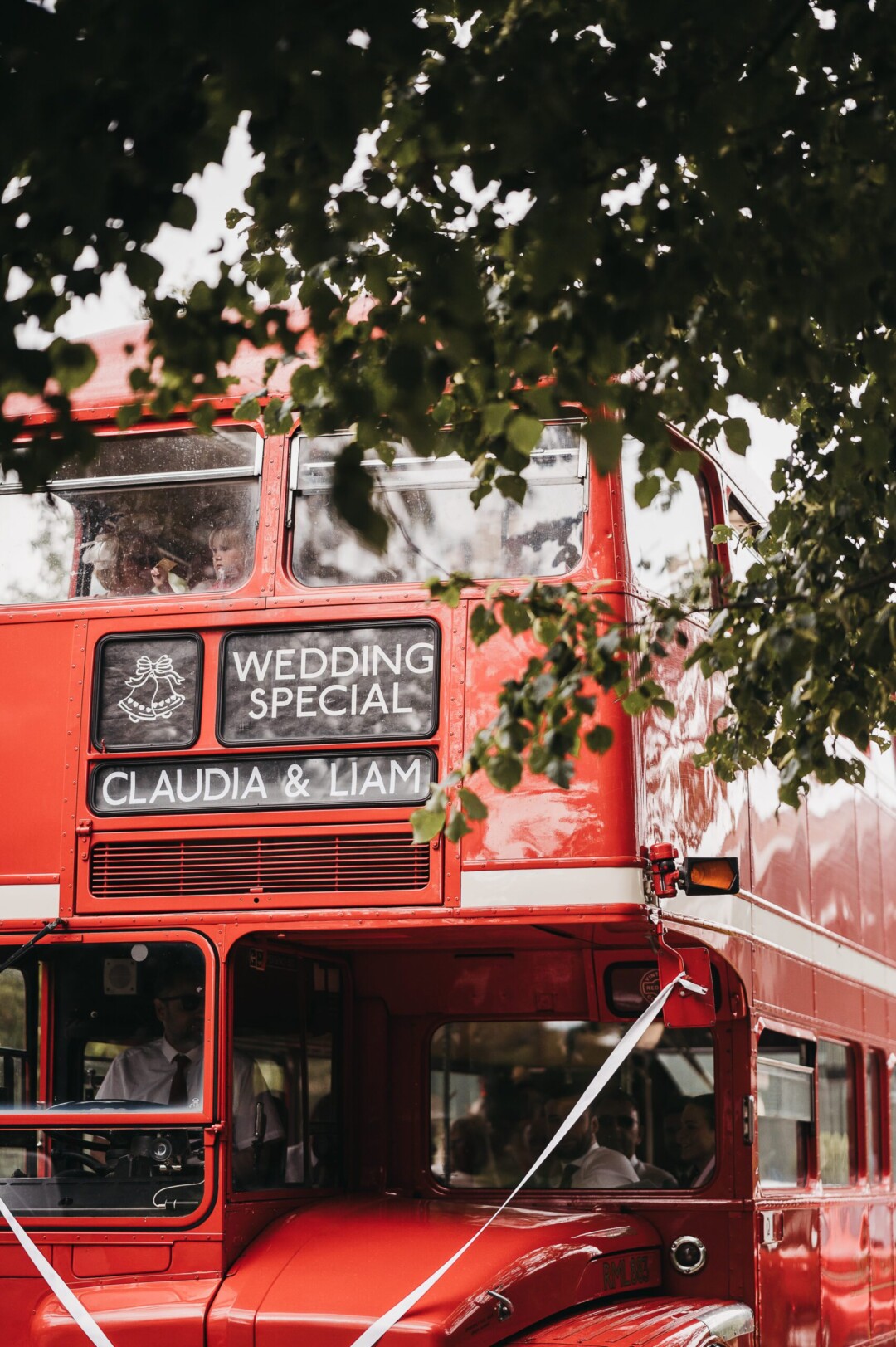 Guests arriving on red bus