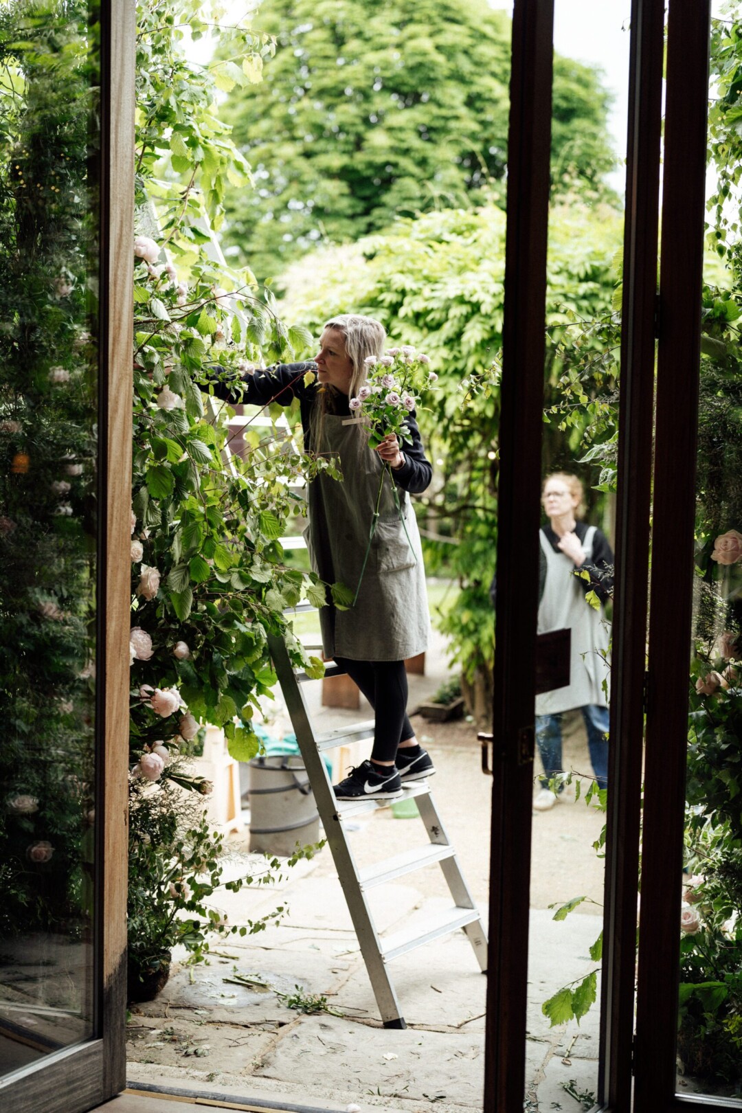 Florists preparing the outdoor floral arch