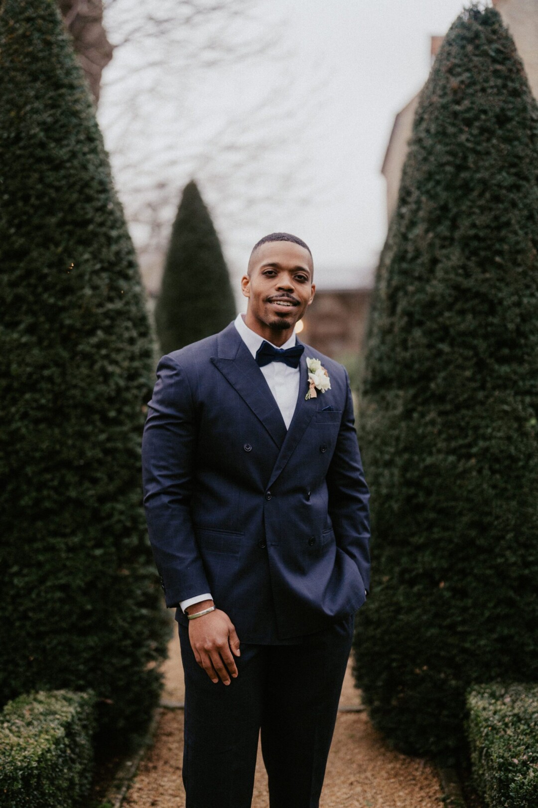 Groom in black tie for winter wedding