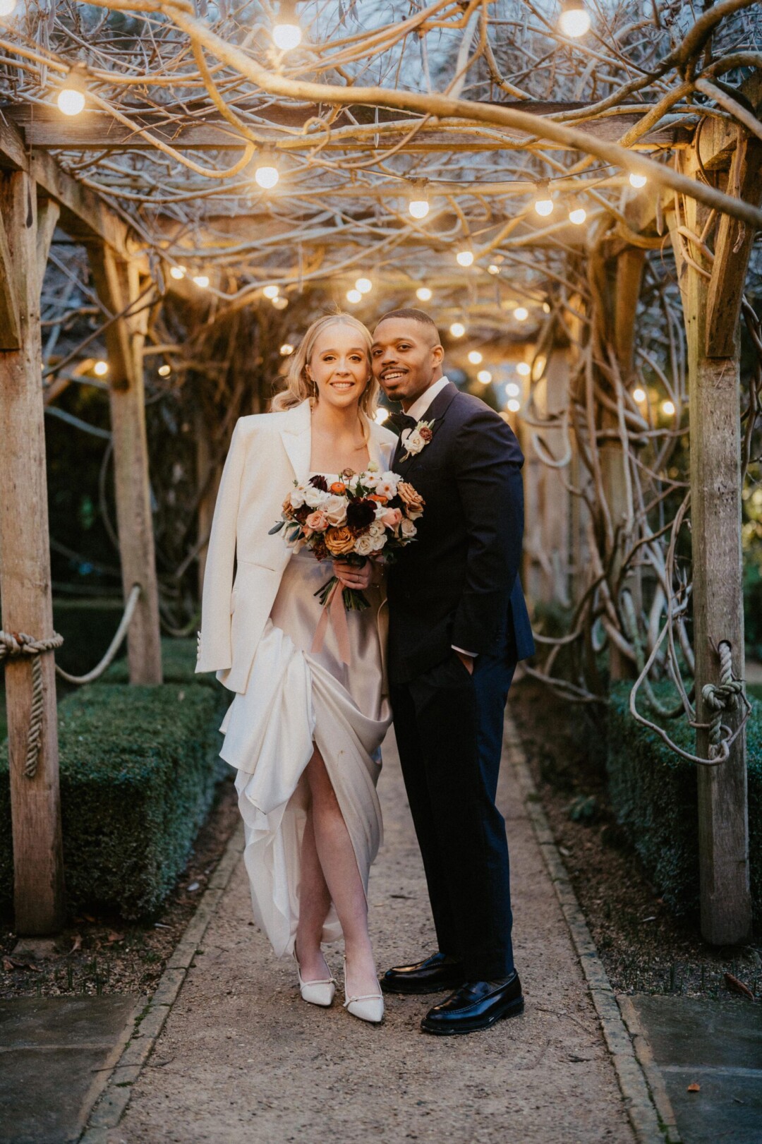 Winter couple under the outdoor wedding aisle