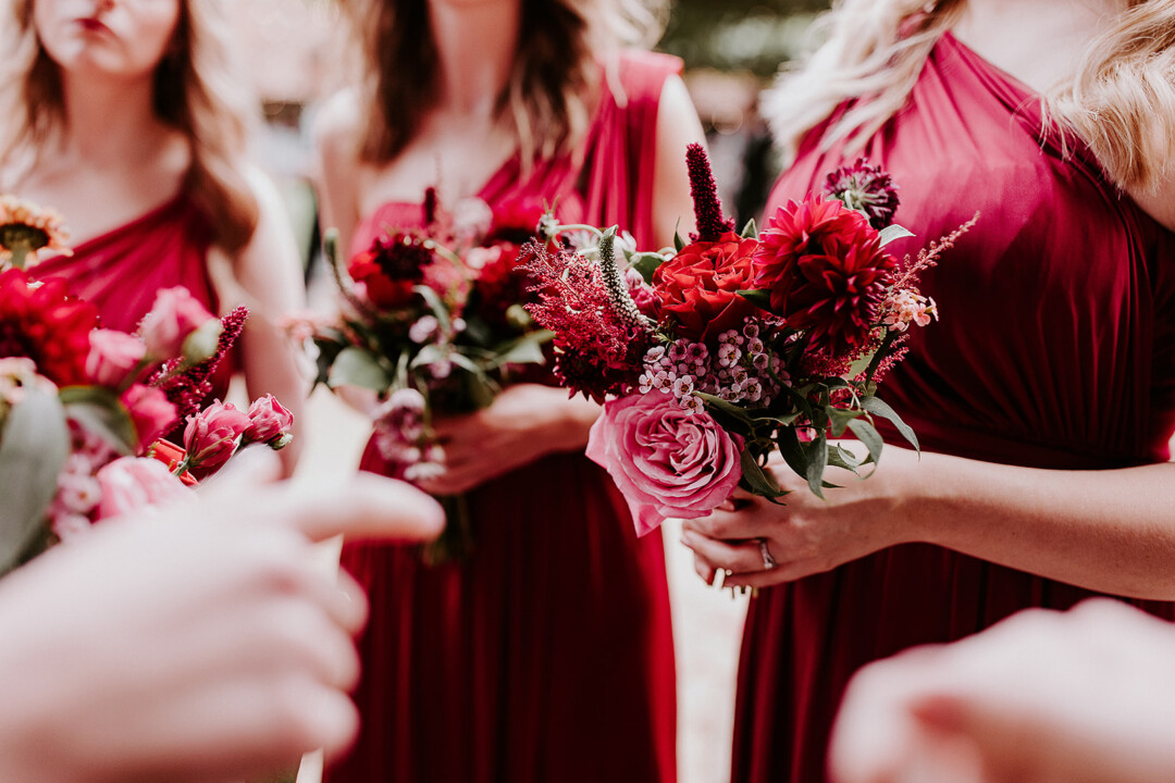 Autumn Berry bridesmaids dresses with red flowers